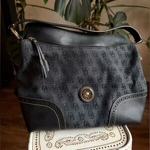 Dooney & Bourke Black Monogram Shoulder Bag with Perforated Leather and Tassels